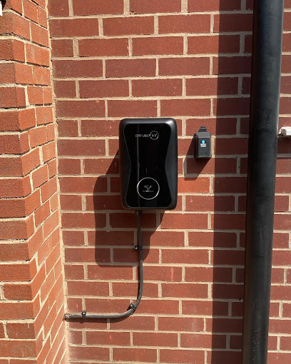 EV charger neatly installed on a UK home brick wall